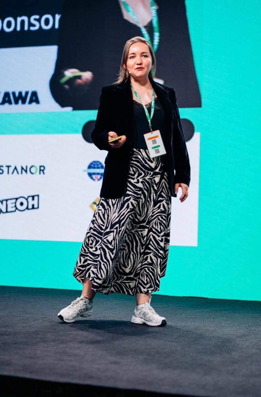 Alfiia speaking on stage
